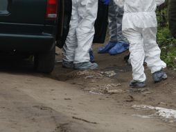 Personal de la Fiscalía , como peritos en criminalística y químicos acudieron a realizar los trabajos forenses. EL INFORMADOR / ARCHIVO