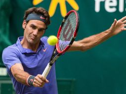 Roger Federer se impuso a Ernests Gulbis en poco más de una hora, durante su partido de Octavos de Final disputado ayer. AFP / M. Hitij