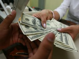 El tipo de cambio para solventar obligaciones es de 15.2828 pesos. EL INFORMADOR / ARCHIVO