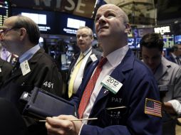 Los indicadores en Wall Street reaccionaron negativamente al anuncio de Grecia de que mantendrá bancos cerrados. AP / R. Drew