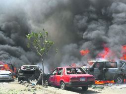 La calle de la capital egipcia por donde pasaba el finado funcionario tras la explosión que causó destrozos en una varios vehículos. EFE /