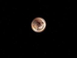 Plutón se puede observar con un hemisferio norte brillante y Caronte con una región polar oscura. TWITTER / @NASA