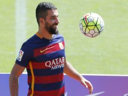 Turan negó haber salido del Atleti por cansarse del estilo defensivo. EFE / A. García