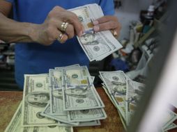 El Banxico informó que el tipo de cambio para solventar obligaciones es de 15.6728 pesos. EL INFORMADOR / ARCHIVO