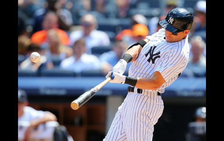 Jacoby Ellsbury batea un doble propulsor de dos carreras en la quinta entrada. AFP / M. Stobe