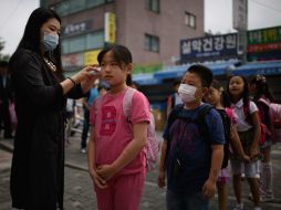 La epidemia afectó al crecimiento de la cuarta economía asiática. AFP / ARCHIVO