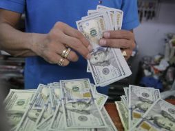 El instituto central informa que el tipo de cambio para solventar obligaciones en moneda extranjera es de 16.3762 pesos. EL INFORMADOR / ARCHIVO