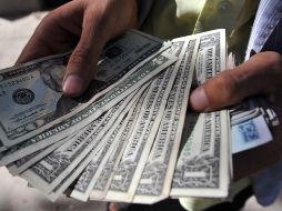 Se prevé que el tipo de cambio cotice este viernes en un rango de entre 16.28 y 16.51 pesos por unidad. AFP / ARCHIVO