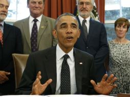 Obama apunta que aún hay barreras para poder votar y demasiadas personas que intentan hacer más difícil votar. AFP / Y. Gripas