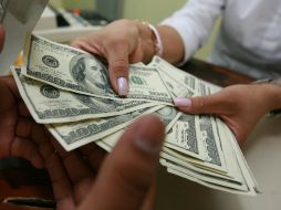 El Banxico indicó que el tipo de cambio para solventar obligaciones en moneda extranjera es de 16.1645 pesos. EL INFORMADOR / ARCHIVO