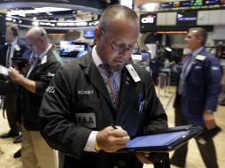 La jornada estuvo marcada por la devaluación del yuan en China y una nueva caída en el precio del petróleo. AP / R. Drew