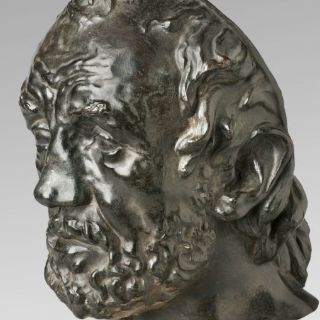 Roban busto de Rodin en Copenhague a plena luz del día