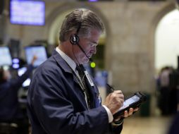 El índice industrial Dow Jones muestra un avance de 233.36 puntos. AP / R. Drew