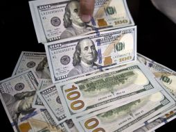 El real cerró la jornada del jueves en 3.8533 unidades por dólar. AFP / V. Almeida