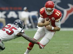 Alex Smith pasó para 243 yardas y tres touchdowns en la primera mitad. AFP / B. Levey