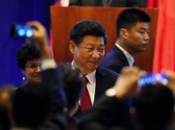 Xi Jinping sostiene páticas sobre cómo expertos y empresarios de ambas naciones pueden colaborar. AFP / M. Ralston