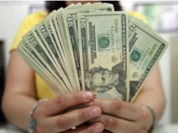 El tipo de cambio para solventar obligaciones en moneda extranjera pagaderas en la República Mexicana es de 17.1149 pesos. EL INFORMADOR / ARCHIVO