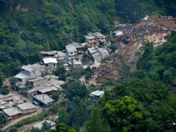 Las labores de búsqueda y rescate en Cambray II se encuentran suspendidas por las condiciones de lluvia. EFE / STR