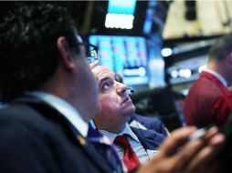 La Bolsa de Valores de Nueva York opera con mínimas ganancias en espera de la publicación de datos de balanza comercial en EU. AFP / S. Platt