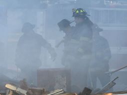 Equipos seguían en el sitio, pero el incendio estaba controlado. AP / K. Myers