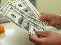 Banxico informa que el tipo de cambio para solventar obligaciones denominadas en moneda extranjera en el país es de 16.5284 pesos. EL INFORMADOR / ARCHIVO