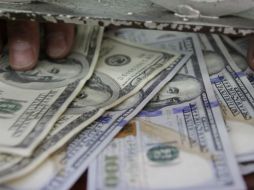 Sobre la cotización del dólar, el Banco Base refiere que para marzo del 2016 se vendería en 17.50 pesos. EL INFORMADOR / ARCHIVO