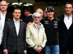 Peña Nieto, acompañado del presidente de la FIA y el piloto tapatío 'Checo' Pérez. AFP / L. Baron