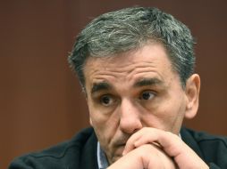 Euclid Tsakalotos, ministro de Finanzas de Grecia, espera que su gobierno cumpla las exigencias de los acreedores. AFP / E. Dunand
