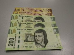 El peso inicia la sesión con una depreciación de 0.45 por ciento al cotizar en alrededor de 16.80 pesos por dólar. EL INFORMADOR / ARCHIVO