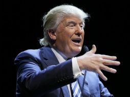 Trump comenta que es 'una locura' que EU vaya a aceptar a cualquier refugiado sirio a raíz de los ataques. AP / C. Neibergall