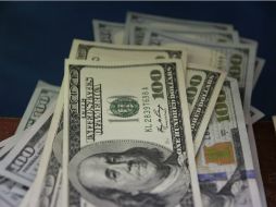 El tipo de cambio solventar obligaciones en moneda pagadera en el País es de 16.7570 pesos, explica Banxico. EL INFORMADOR / ARCHIVO