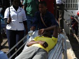 La comunidad entró en pánico cuando fuerzas de seguridad utilizaron lo que pensaban que era munición real. AFP / J. Muchucha