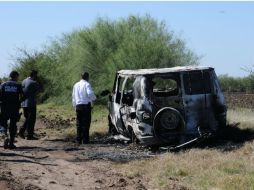 La novia de Adam Coleman dice que hay un 99 por ciento de probabilidad que los cuerpos calcinados sean de los surfistas. AFP / STR