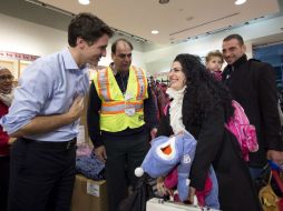 La primera familia en llegar fue la de Kevork Jamkossian, con su esposa Georgina Zires y su hija Madeleine. AP / N. Dennete