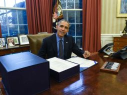 Con la firma del proyecto de ley llegan a su fin meses de negociaciones, y evitar una parálisis gubernamental. AFP / N. Kamm