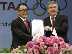 Toyoda (i) también es miembro del comité de la federación empresarial japonesa para los Juegos. AP / ARCHIVO