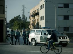 Policías son apostados en las calles después de una noche de destrucción. AFP / J. Guerrero