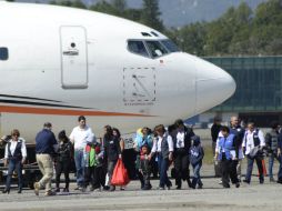 Los 123 hondureños arribaron este miércoles en San Pedro Sula, norte de Honduras. AFP / O. Estrada