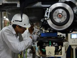 Las industrias manufactureras, que envían una gran parte de su producción al mercado estadounidense, cayeron 0.4 por ciento. AFP / ARCHIVO