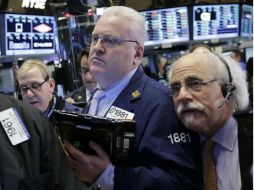 El selectivo S&P 500 y el índice compuesto del mercado Nasdaq cerraron con progresos. AP / M.  Lennihan