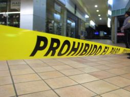 Autoridades ministeriales acordonan el área para realizar el levantamiento de los cuerpos, que presentaban impactos de arma de fuego. EL INFORMADOR / ARCHIVO