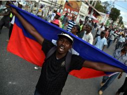 La constitución haitiana no contempla el escenario que se presenta en la isla, donde se manifiestan por un supuesto fraude electoral. AFP / H. Retamal
