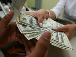 El tipo de cambio para solventar obligaciones en moneda extranjera pagaderas en el País es de 18.1948 pesos, según Banxico. EL INFORMADOR / ARCHIVO