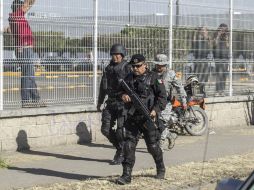 Elementos de Operaciones Especiales de la Policía recorren el sitio donde ocurrió el tiroteo; confirman que el Ejército no intervendrá. EL INFORMADOR / R. Tamayo