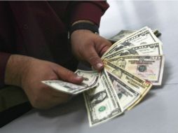 Banco Base espera que el tipo de cambio oscile entre 17.80 y 18.10 pesos por dólar. EL INFORMADOR / ARCHIVO