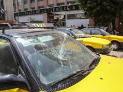 Tras la trifulca, siete vehículos resultaron con daños. EL INFORMADOR / A. García