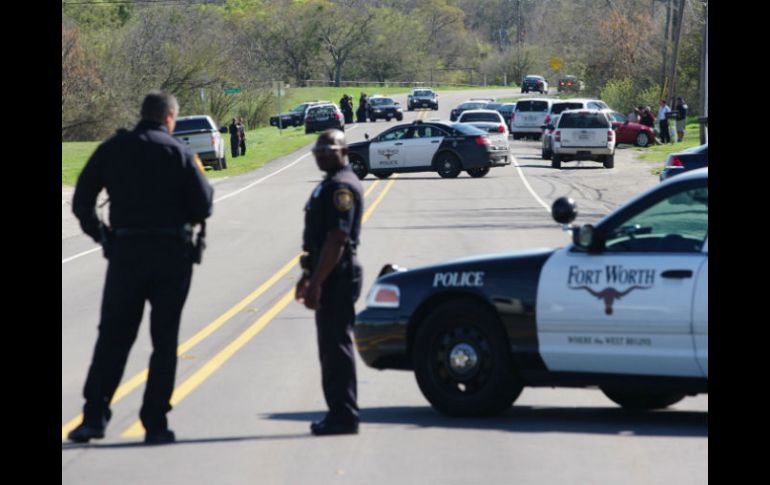 La balacera sobrevino poco después de las 14:00 horas luego de que los agentes persiguieran un automóvil. AP / L. Jenkins / The Dallas Morning News