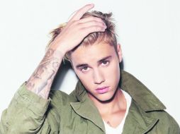 Desanimado. Justin Bieber confesó que le cuesta mucho atender a sus fanáticas. AFP /