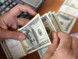 Banxico fija el tipo de cambio en 17.2279 para solventar obligaciones. AFP / ARCHIVO