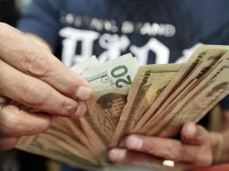 Los precios de la divisa se exhiben en los centros cambiarios localizados en el Aeropuerto Internacional de la Ciudad de México. EL INFORMADOR / ARCHIVO